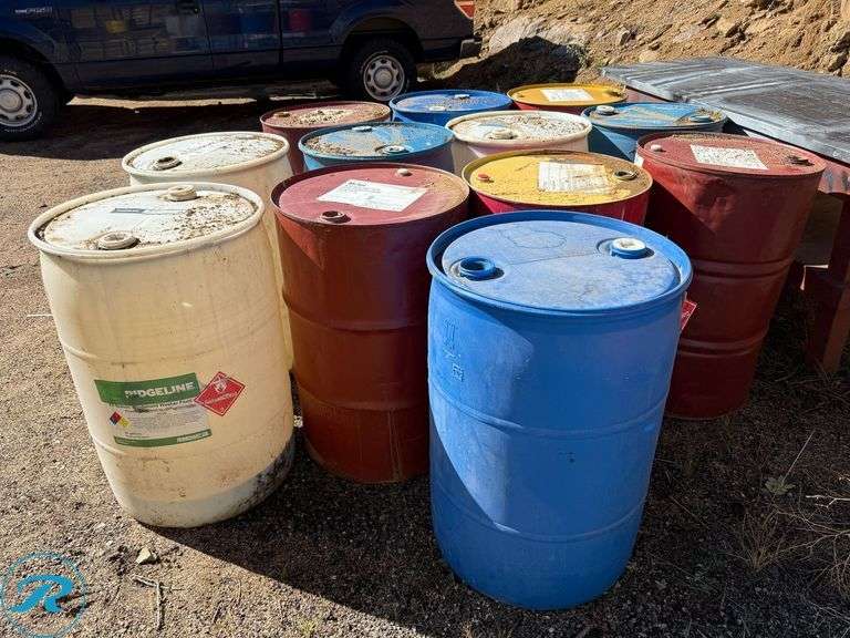 (5) Metal and (7) Plastic Empty 55 Gallon Barrels - Roller Auctions