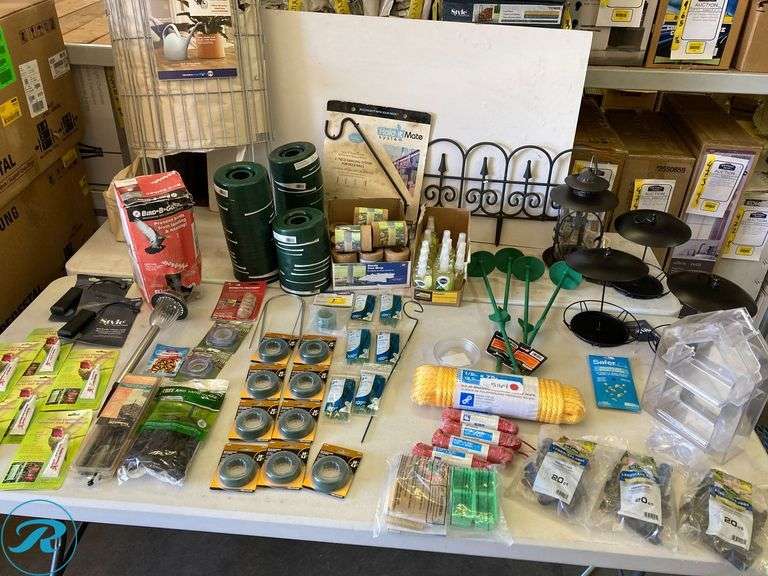 (132) New- Assorted Garden Supplies includes green floral wire, cable ties, sturdy tree wrap hanging for deck, sprinkler, watering can bin, bird feeder (see photos) - Roller Auctions