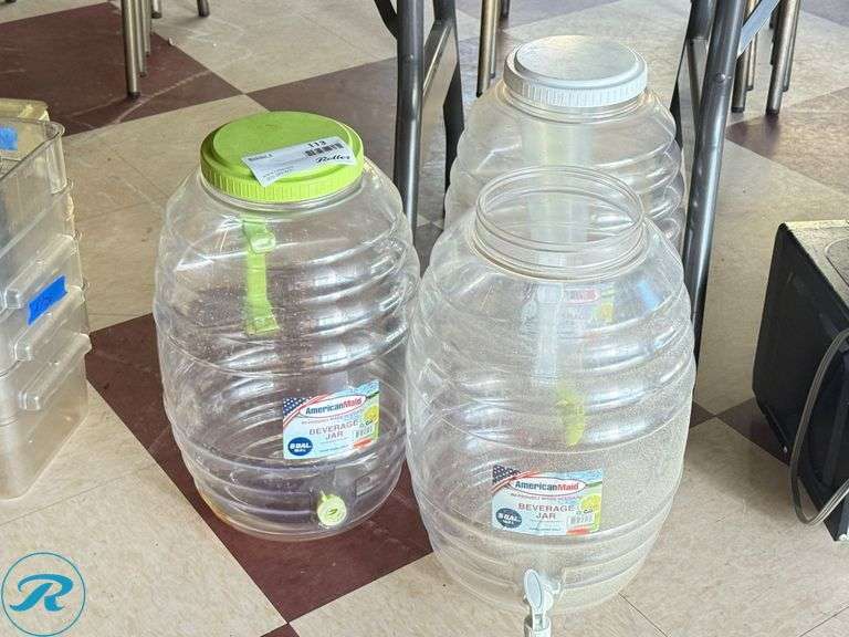 Three Clear Plastic Beverage Dispensers with Spigots - Roller Auctions
