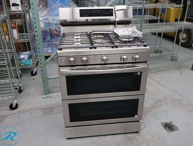 Samsung 6.0 cu. ft. Smart Freestanding Gas Range with Flex Duo and Air Fry - Used - $1,599 Retail, Damaged/Leaking Gas/Notes From Xcel Energy "Thread Of Flex Hose Leaking Into Gas Regulator, Brass Fitting On Face Of Regulator Is Leaking Gas" - Roller Auctions