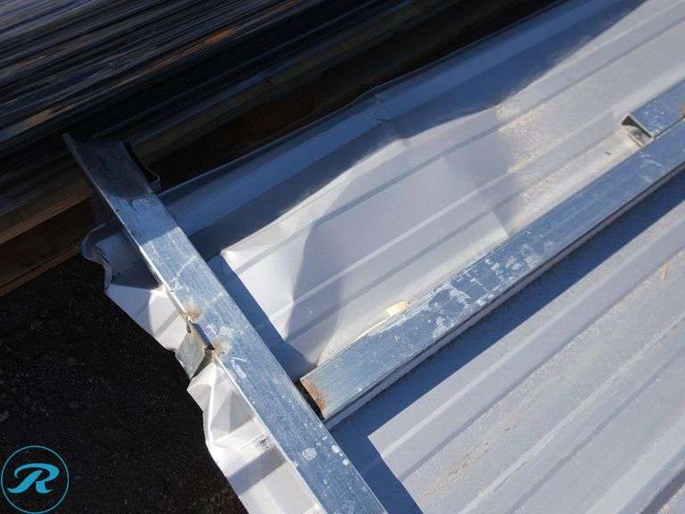 (100) New Sheets of KJ K0311 Galvalume Corrugated Steel Panels, 10' x 35" (Top Few Panels Damaged) - Roller Auctions