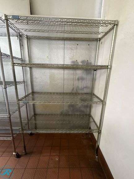 (2) Metal Wire Racks, 48” x 18” x 76”H and 48” x 18” x 74”H - Roller Auctions
