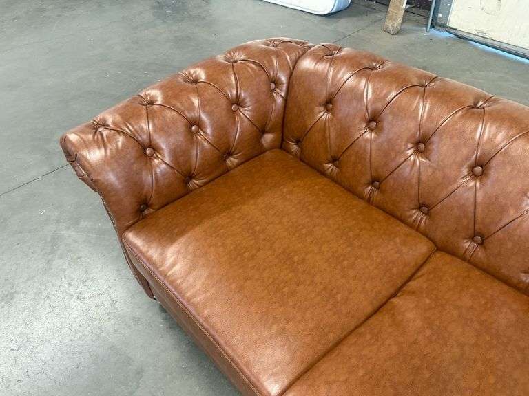 Chesterfield Style Tufted Brown Leather Like Sofa With Rolled Arms And Nailhead Trim, 82in - Roller Auctions