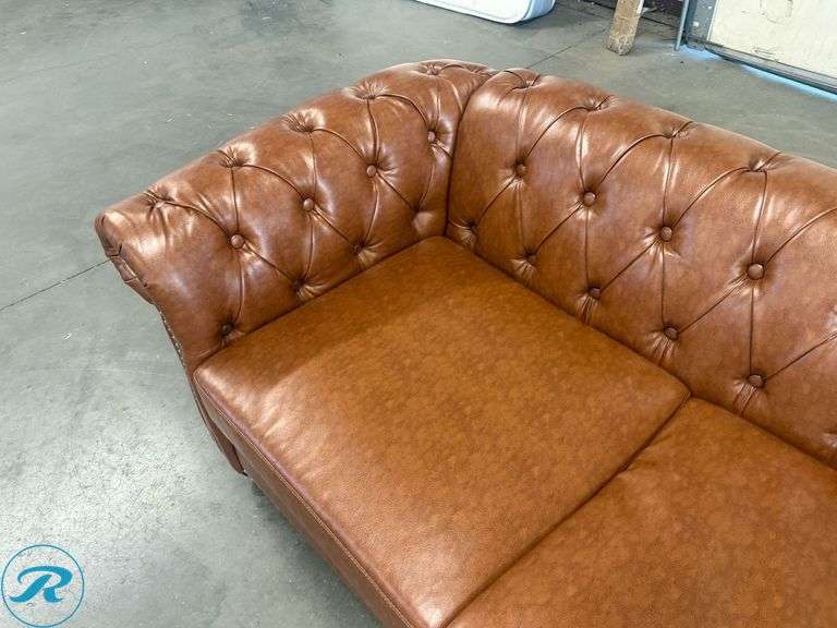 Chesterfield Style Tufted Brown Leather Like Sofa With Rolled Arms And Nailhead Trim, 82in - Roller Auctions
