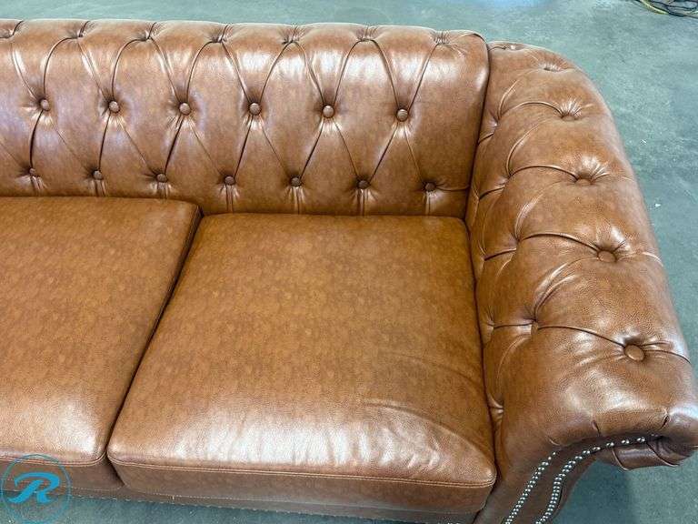 Chesterfield Style Tufted Brown Leather Like Sofa With Rolled Arms And Nailhead Trim, 82in - Roller Auctions