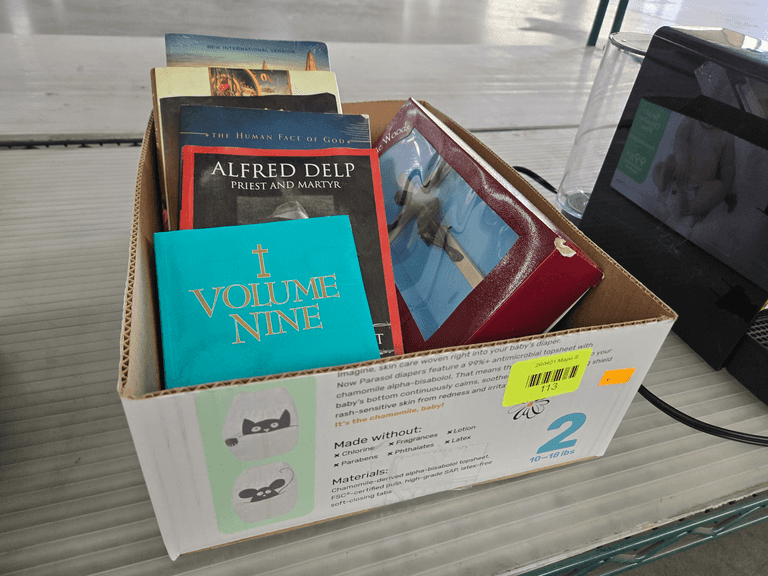 Assorted Religious Books and Crucifix Display