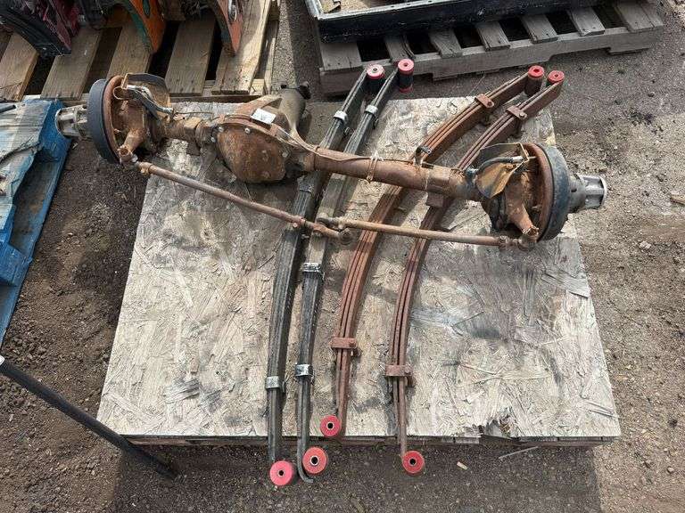 Pallet of Willys Jeep Front Axle Assembly With Leaf Springs and Drum Brakes - Roller Auctions