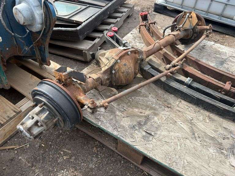 Pallet of Willys Jeep Front Axle Assembly With Leaf Springs and Drum Brakes - Roller Auctions