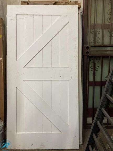 42-in x 84-in White Primed K-Frame MDF Solid Core Single Barn Door (It has some stains and Scratches for being stored, please look the pictures)