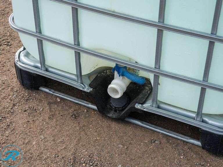 Caged Poly Tank With Approximately 130-Gallons of Diesel Exhaust Fluid (DEF) - Roller Auctions