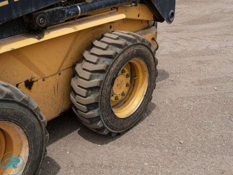 1999  New Holland  LX665   Skid Steer Loader - Roller Auctions