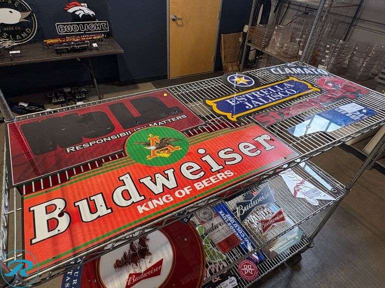 Shelf of Assorted Beer Signs