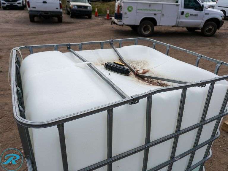 Caged Poly Tank With Approximately 130-Gallons of Diesel Exhaust Fluid (DEF) - Roller Auctions