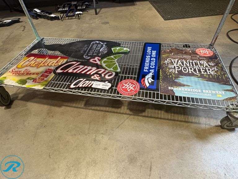 Shelf of Assorted Beer Signs