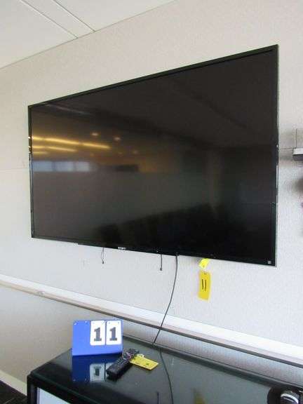 WALL MOUNTED SONY TV, APPROX. 70" WITH REMOTE CONTROL **BUYER RESPONSIBLE FOR PROPER REMOVAL**