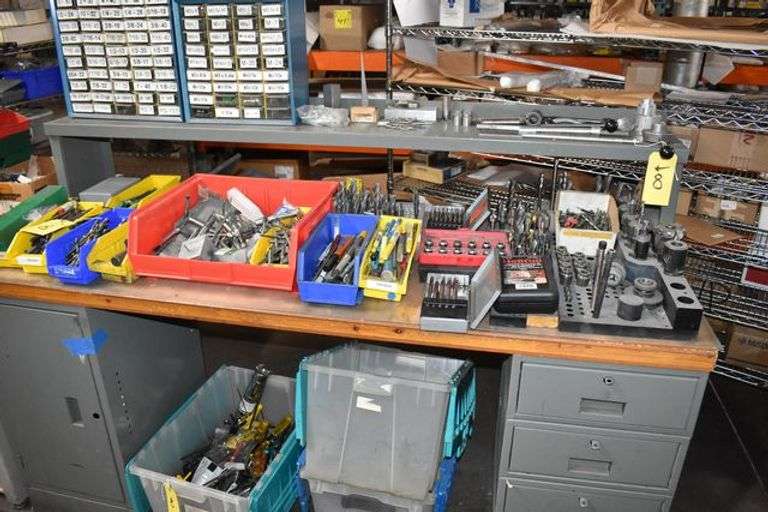 METAL BENCH, APPROX. 28" X 72", METAL RISER WITH CONTENTS, RHEAMERS, DRILLS, TAPS, END MILLS, TOOL HOLDERS, AND MORE AS SHOWN