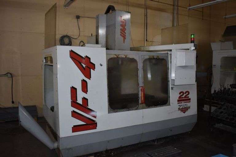 1997 HAAS VF4 CNC MILLING CENTER, 22 HP, HIGH TORQUE, 710 IPM, BRUSHLESS SERVOS, S/N 9809, W/CHIP TOTE CONVEYOR