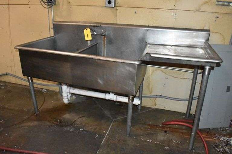 STAINLESS STEEL SINK, APPROX. 6' LONG, (2) BASINS WITH DRAIN RAMP, (BUYER TO REMOVE IN A PROFESSIONAL MANOR)