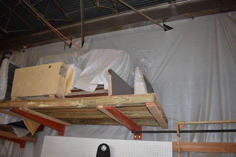 *EMPTY* CANTILEVER RACK - APPROX. 5'W X 4'D X 20"T WITH (8) 4' ADJUSTABLE ARMS *BOLTED TO GROUND - BUYER MUST FLUSH CUT BOLTS TO GROUND* (DELAYED PICKUP)