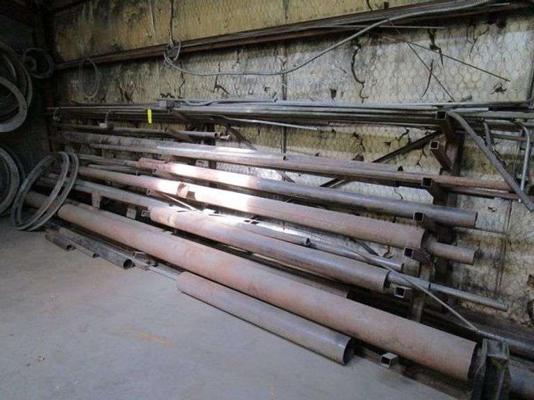 LOT, (1) STEEL STORAGE RACK, APPROX. 16' LONG W/ASSORTED STEEL STOCK ...