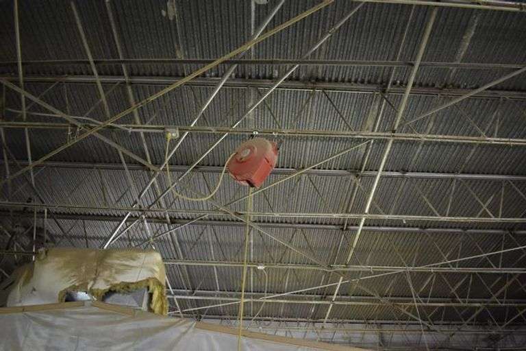 ELECTRIC CORD REEL ATTACHMENT  *BOLTED TO CEILING - BUYER WILL NEED TOOLS AND LADDER TO REMOVE FROM THE CEILING TRUSS*  (sold 2x the money)