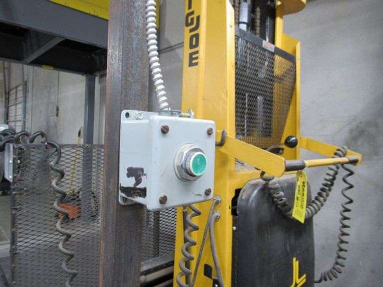 BIG JOE WALK BEHIND ELECTRIC LIFT TRUCK MDL. 2024-T9, S/N 353867, 2,000 LB CAPACITY, 108" LIFT HEIGHT, HARD WIRED TO OUTLET, W/5' X 76" METAL SAFETY CAGE W/RAMP, (DELAYED PICKUP), (BUYER RESPONSIBLE FOR UNBOLTED AND UNWIRED)