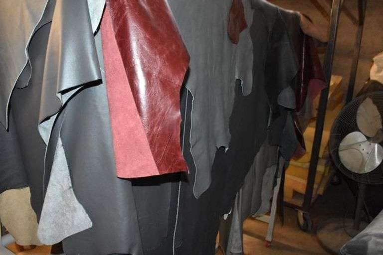 PORTABLE RACK WITH ASSORTED LEATHER AS SHOWN