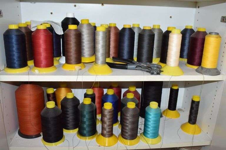 CABINET OF ASSORTED SEWING THREADS AS SHOWN