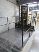 BIG JOE WALK BEHIND ELECTRIC LIFT TRUCK MDL. 2024-T9, S/N 353867, 2,000 LB CAPACITY, 108" LIFT HEIGHT, HARD WIRED TO OUTLET, W/5' X 76" METAL SAFETY CAGE W/RAMP, (DELAYED PICKUP), (BUYER RESPONSIBLE FOR UNBOLTED AND UNWIRED)