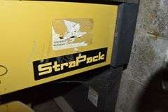 STRAPACK STRAPPING MACHINE WITH (2) ROLLS OF BANDING AND TOOLS AS SHOWN