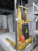 BIG JOE WALK BEHIND ELECTRIC LIFT TRUCK MDL. 2024-T9, S/N 353867, 2,000 LB CAPACITY, 108" LIFT HEIGHT, HARD WIRED TO OUTLET, W/5' X 76" METAL SAFETY CAGE W/RAMP, (DELAYED PICKUP), (BUYER RESPONSIBLE FOR UNBOLTED AND UNWIRED)