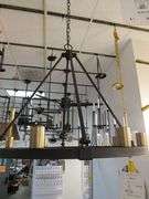 CHANDELIER OR PENDANT AS SHOWN * REFER TO PHOTOS * BUYER RESPONSIBLE FOR REMOVAL - BRING TOOLS AND LADDER AS ITEMS ARE CEILING MOUNTED 12'-14' CEILING HEIGHT*