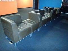 Brown Vinyl Seven Person Lounge Sofa w/ Outlets