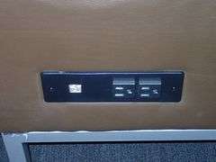 Brown Vinyl Seven Person Lounge Sofa w/ Outlets