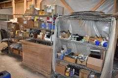 LOT, (2) WIRE RACKS AND (1) WIRE SHELF WITH ASSORTED HARDWARE FOR BUILDING RECLINERS, (1) PALLET, RECLINER PARTS AND (1) PILE OF RECLINER MOTOR ASSEMBLIES AS SHOWN