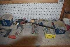 CONTENTS ON WORKBENCH AND PEG BORAD INCLUDING EAR PROTECTION, WRENCHES, SAWS AND CLAMPS