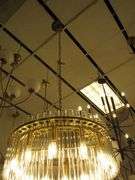 CHANDELIER OR PENDANT AS SHOWN * REFER TO PHOTOS * BUYER RESPONSIBLE FOR REMOVAL - BRING TOOLS AND LADDER AS ITEMS ARE CEILING MOUNTED 12'-14' CEILING HEIGHT*