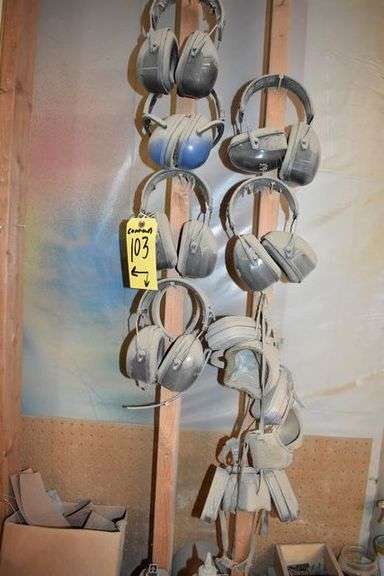 CONTENTS ON WORKBENCH AND PEG BORAD INCLUDING EAR PROTECTION, WRENCHES, SAWS AND CLAMPS