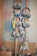 CONTENTS ON WORKBENCH AND PEG BORAD INCLUDING EAR PROTECTION, WRENCHES, SAWS AND CLAMPS
