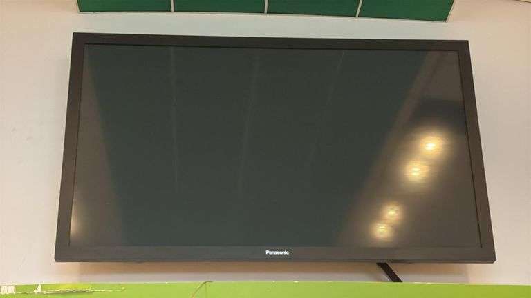 Panasonic flatscreen TV, approximately 85 inches, buyer will need to bring ladder and tools to remove