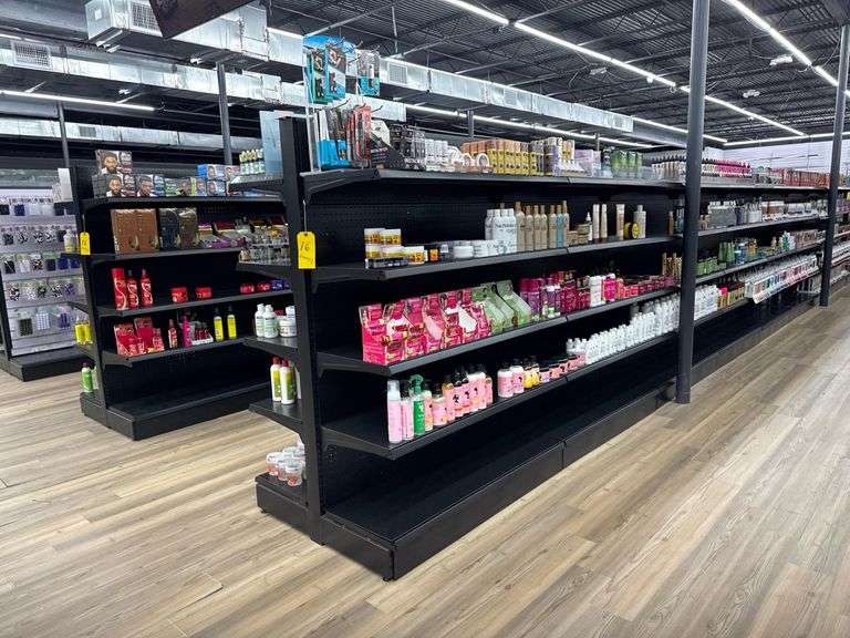 (18) Sections of (Empty) Metal Dual Sided Shelving Units. Each Unit has Four Adjustable Height Shelves. Each Section Measures Approximately 47” X 37” X 65”. Delayed Pick Up Required.
