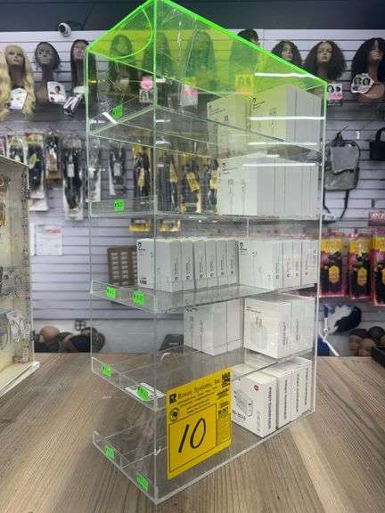 Plexiglass Cubby w/ Assorted Charging Adapters, Ear Phones, and Charging Cables. Plexiglass Cubby Does Show Damage