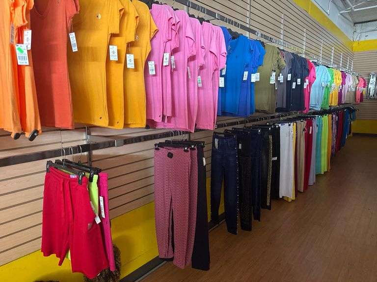 (2) Rows - Large Assortment of Women’s and Men's Fashion Apparel—Dodo T-Shirts, Verta Stone Dress, Assorted Pants, and Shorts, Multiple Colors & Sizes
