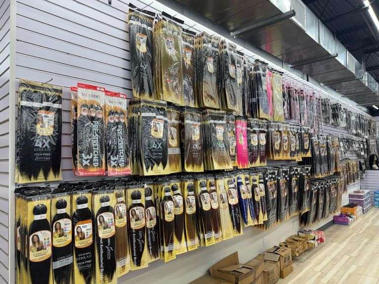 Entire Side Wall Section of Braids Including Spetra EZBrand Professional, LaFlare Human Hair, Saga Brazilian Remy Humy Hair, Shake N Go Human Hair, and Onyx Legacy. Preview Recommended to Judge Large Quantity. Please Note: Magnet Security Tags on Items