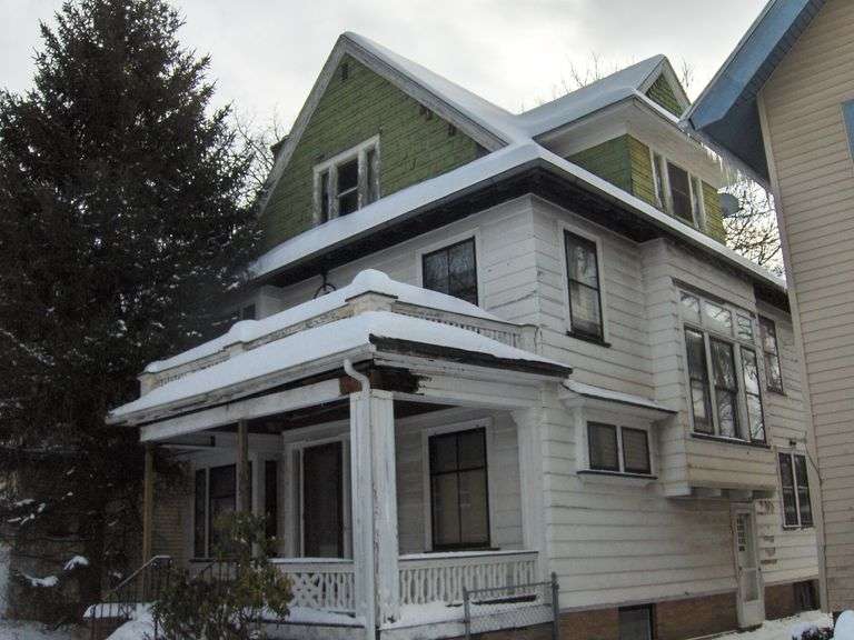Architectural Gem in Rochester’s 19th Ward – Stained Glass, Pocket Doors & Fireplaces - Starts at $45K!