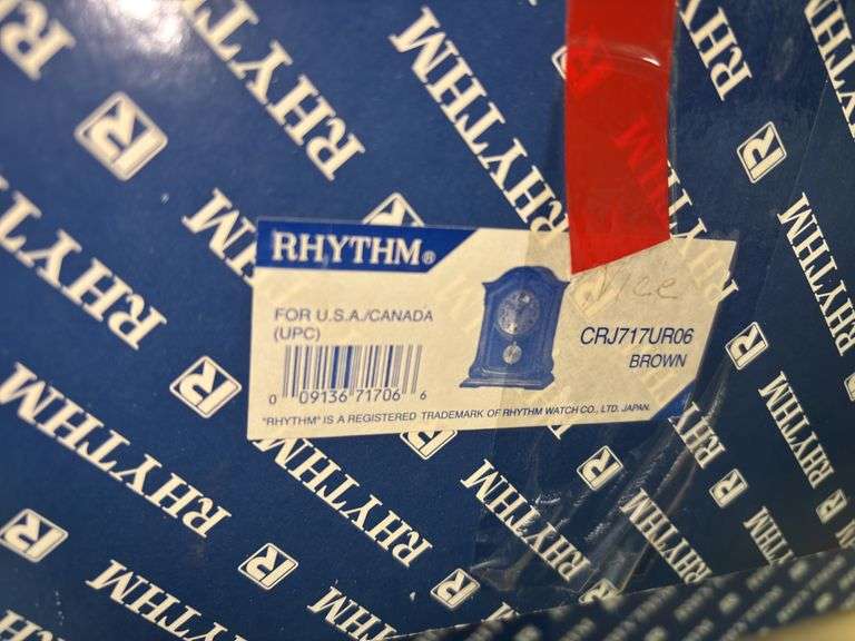 RHYTHM Woodgrain Spiral Pendulum Clock