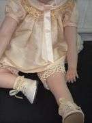 Pair of Porcelain Dolls