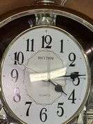 RHYTHM Woodgrain Spiral Pendulum Clock