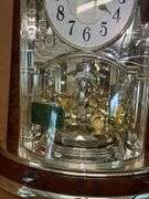 RHYTHM Woodgrain Spiral Pendulum Clock