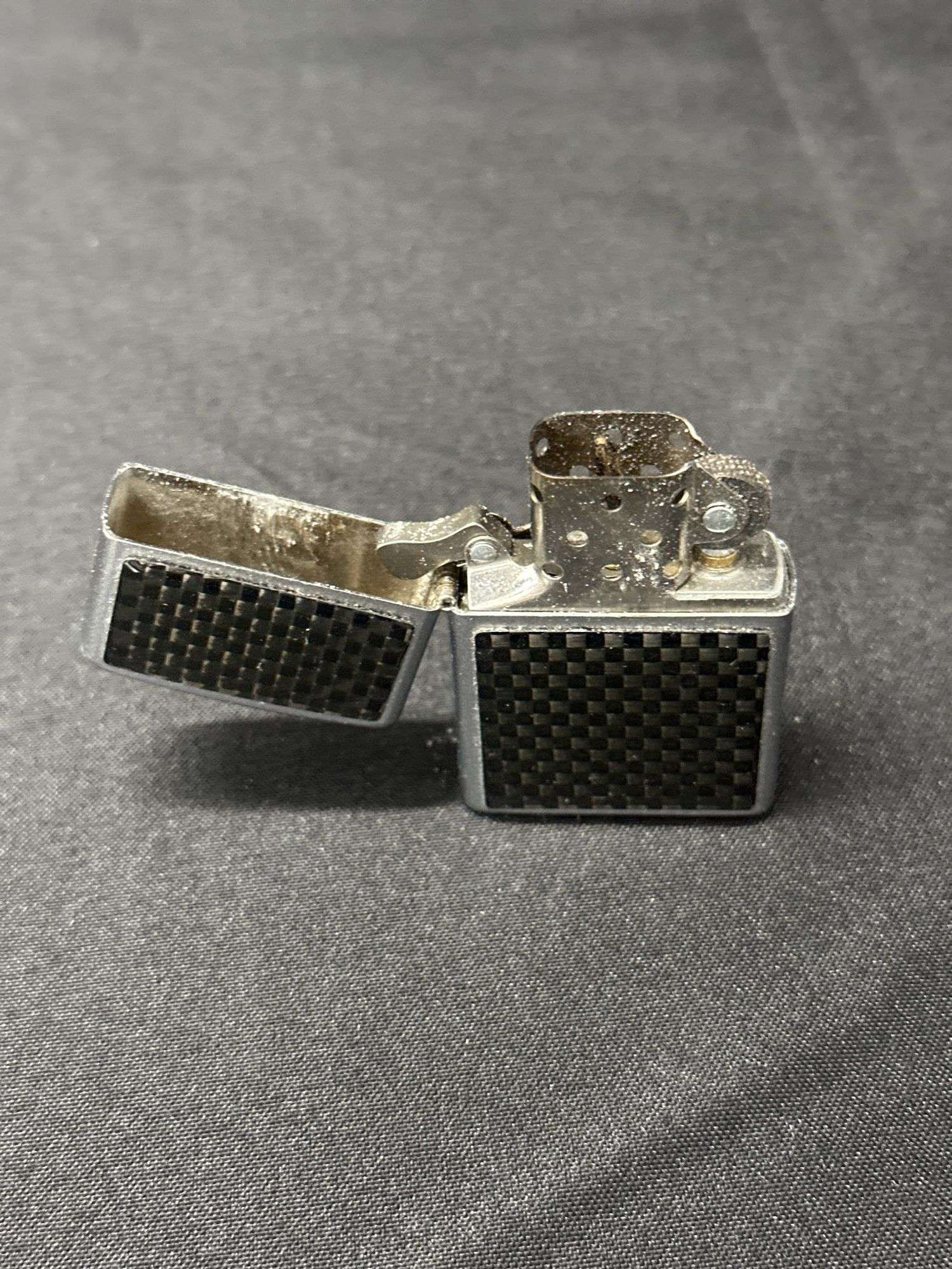 Zippo 2000 Carbon Fiber Lighter - Ryan Cate Auctions and Real Estate